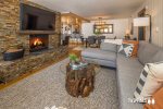 Spacious Living Area with a Beautiful Stone Fireplace